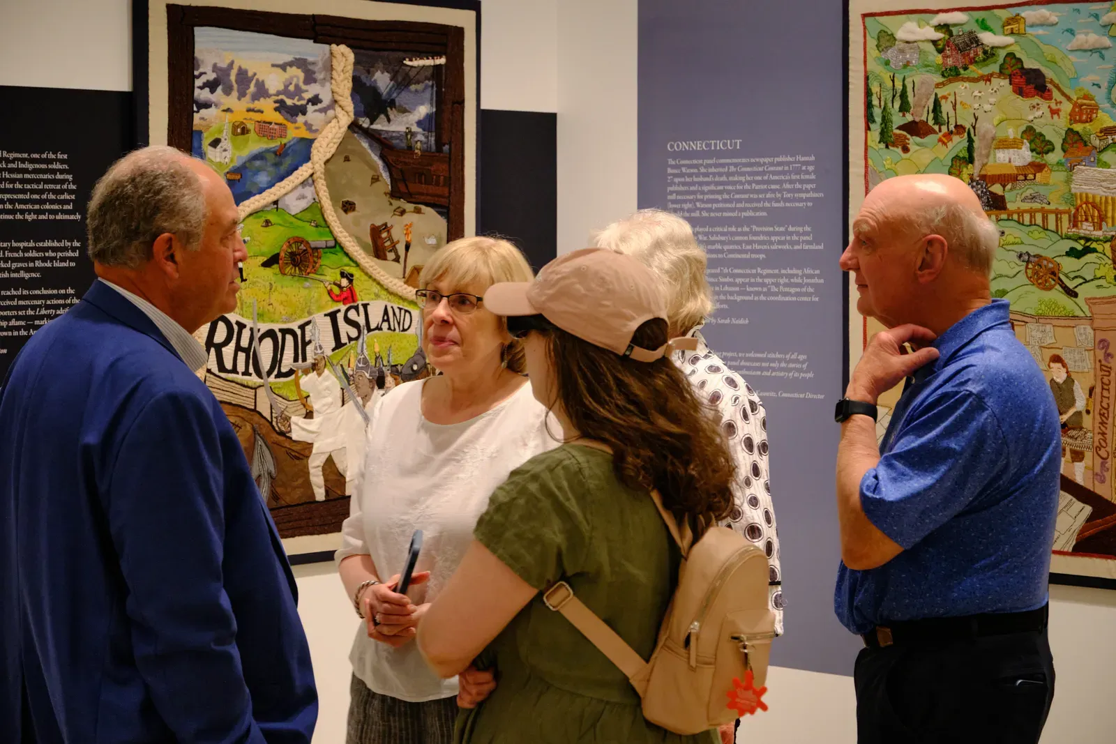 Visitors talk over the Rhode Island and Connecticut panels