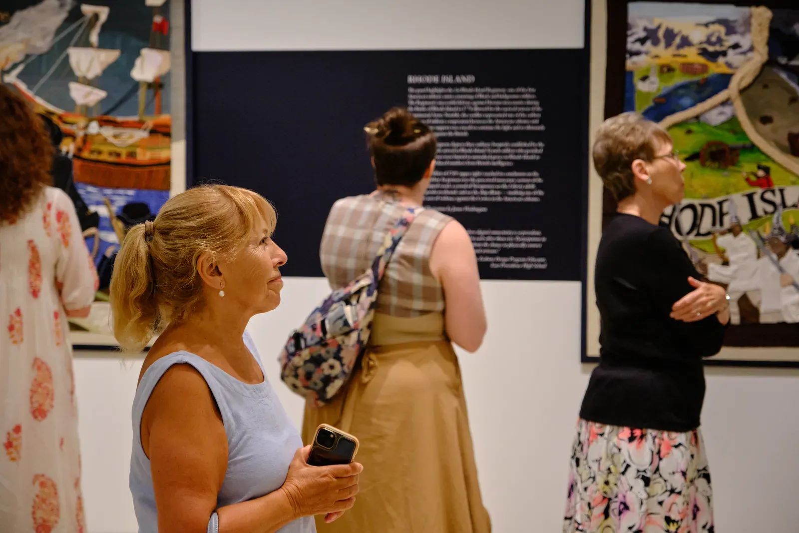 A visitor studies the Rhode Island panel