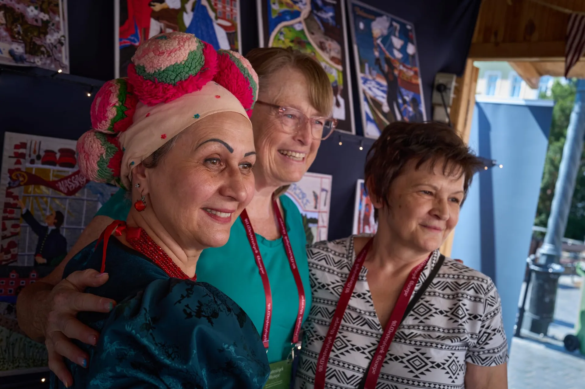 Hungarian embroiderers in traditional dress at the booth